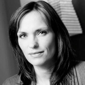 Black and white photo of woman with long dark hair.