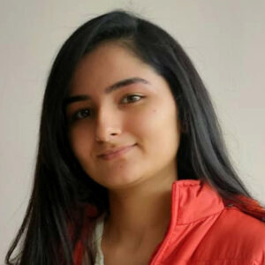 Young woman with dark hair and a red jacket.